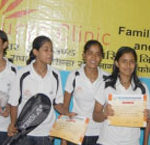 The Bhagalpur women's badminton team receives their prizes at a local sports tournament.