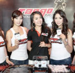 TANGO girls pose at their booth during a press conference.